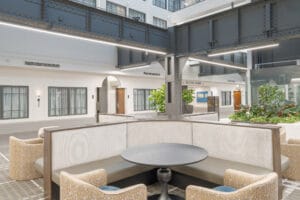 Historic building preservation photography for Bend Oregon heritage architects showcasing successful historic hotel renovation with preserved steel structure and contemporary design integration