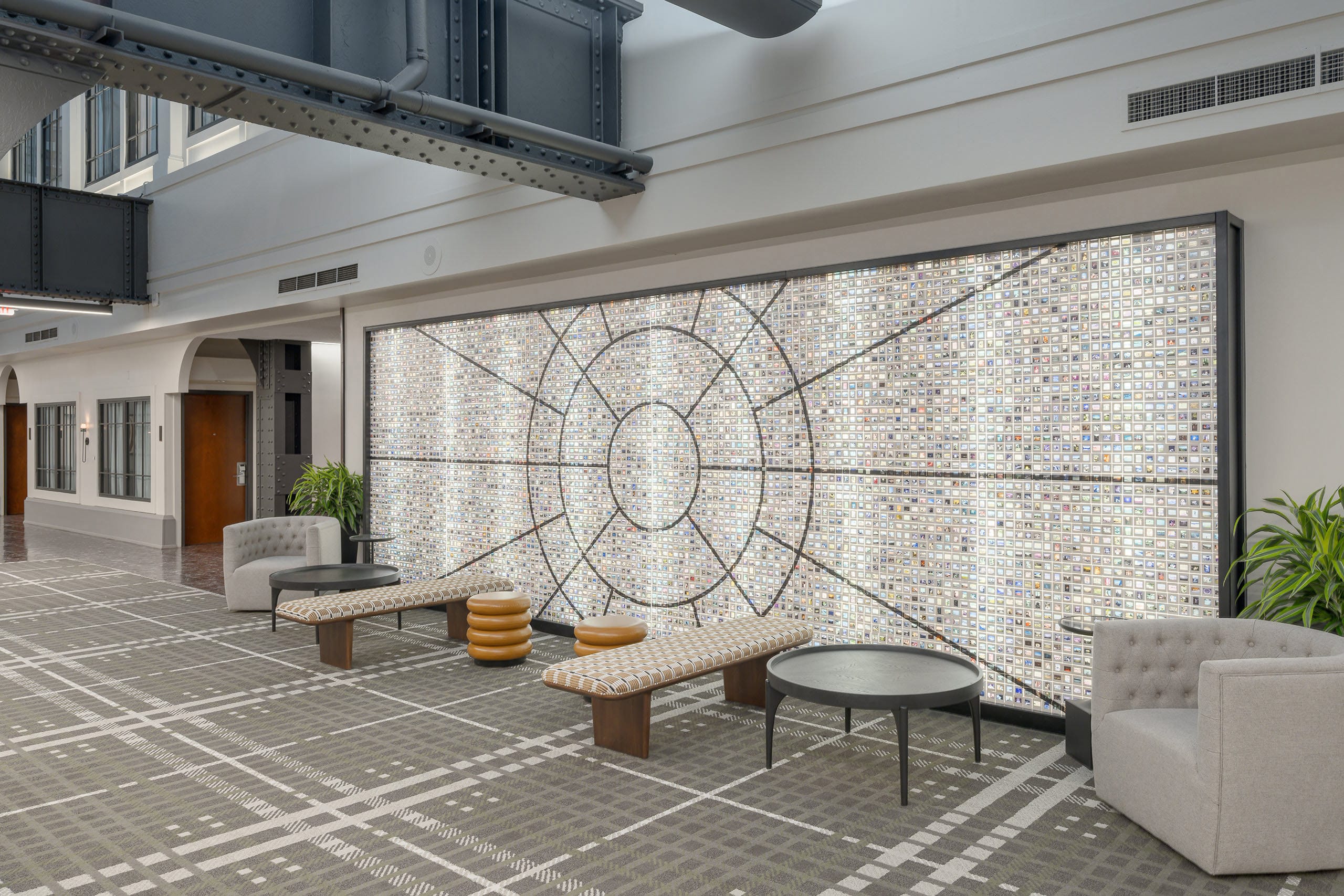 Historic building preservation photography for Bend Oregon heritage architects showcasing successful historic hotel renovation with preserved steel structure and contemporary design integration